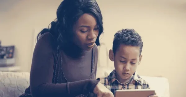 Boy with mum on tablet